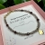 Bransoletka z kamieni naturalnych: kwarc dymny, granat i hematyt + zawieszka koniczynka